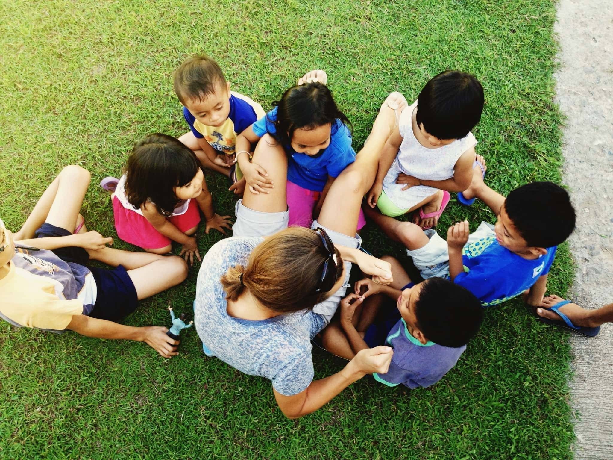 Children around a woman.