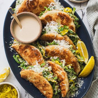 Caesar smash tacos on a plate.