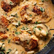 Creamy chicken and gnocchi in a skillet.