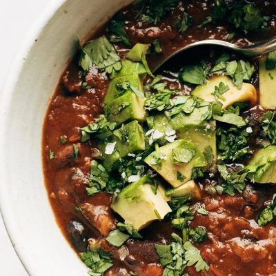 Instant Pot Pumpkin Walnut Chili in bowl with spoon.