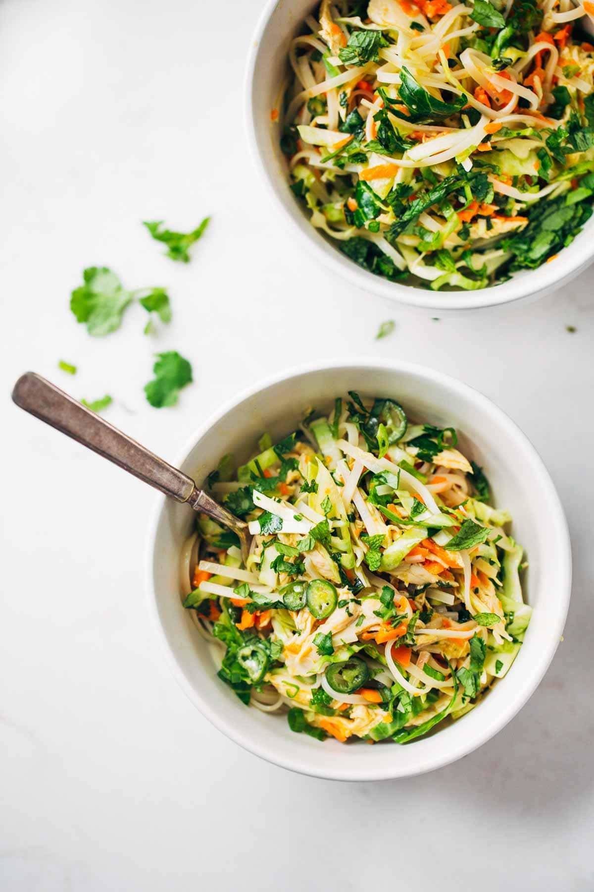Vietnamese Chicken Salad with Rice Noodles in two bowls with a fork.